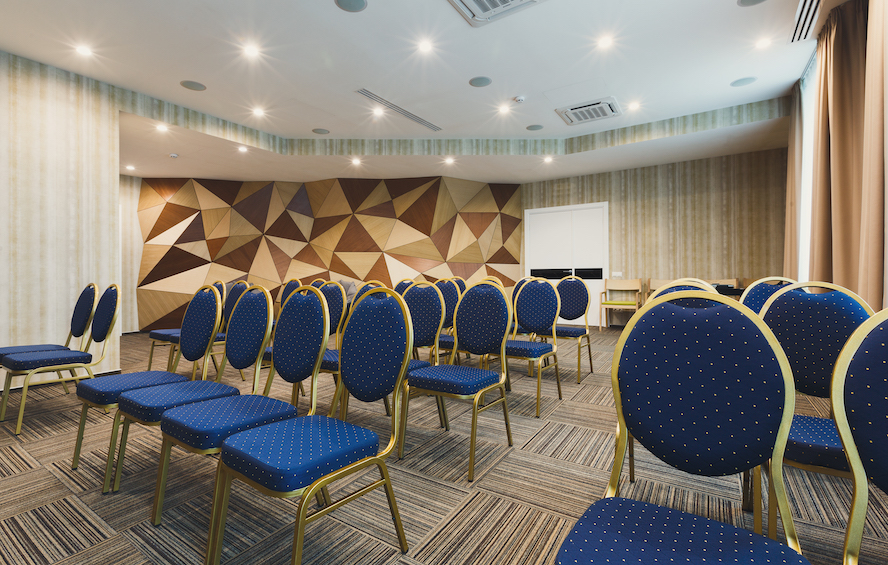 interior of modern conference room - empty seats facing the stage